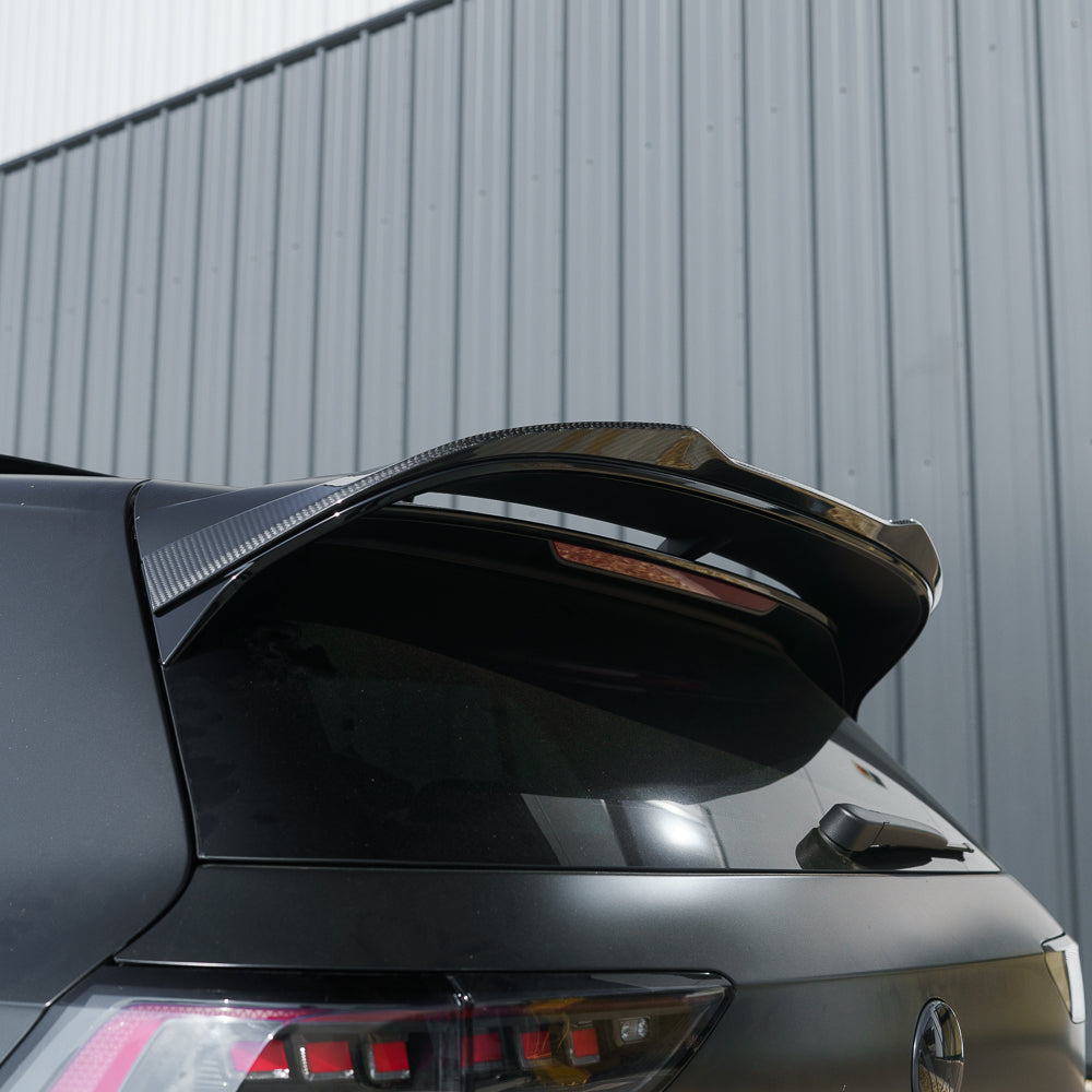 VW Golf MK8 CS carbon fibre spoiler by CT Carbon, shown in satin black, enhances sporty look and aerodynamic performance.