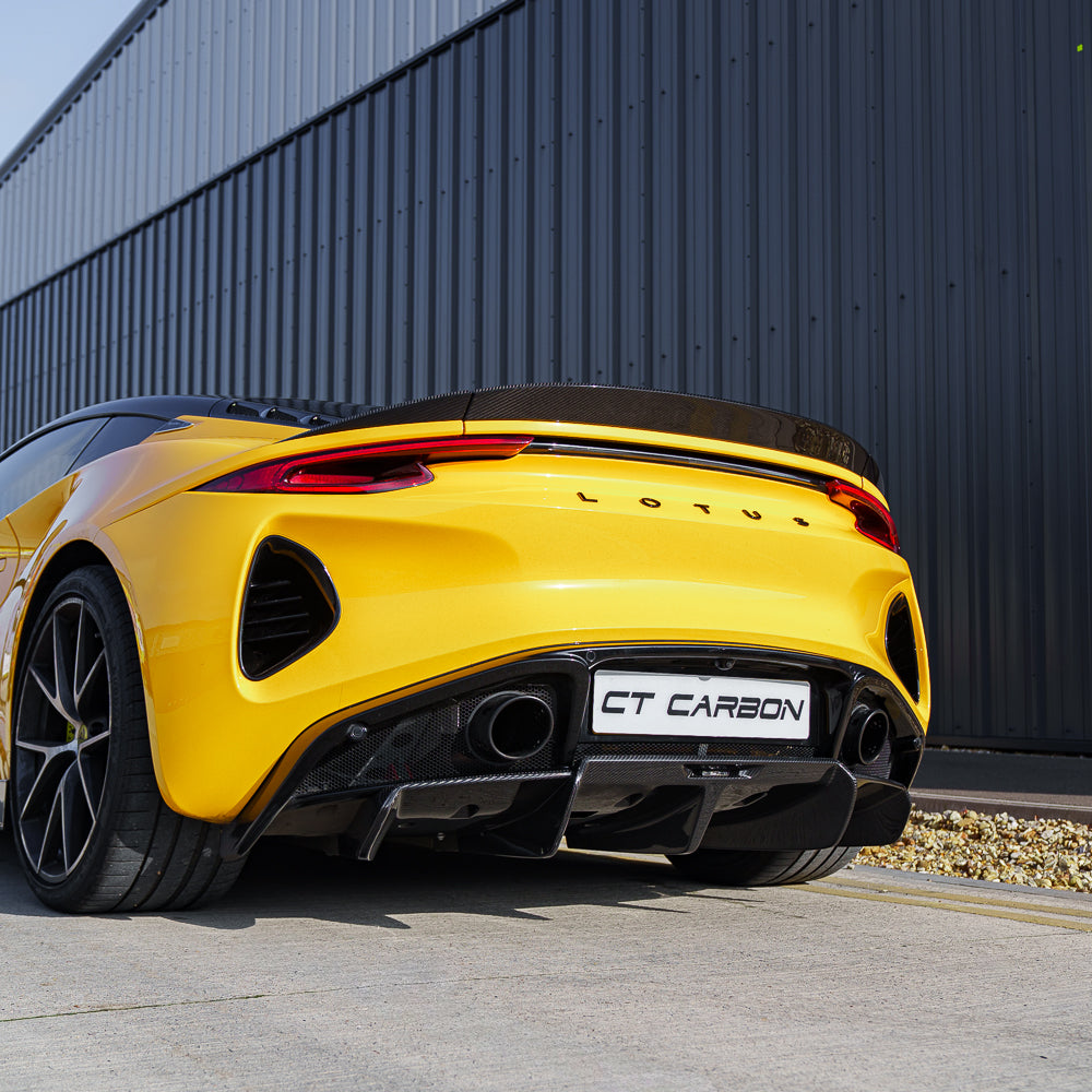 Yellow Lotus Emira full 2022+ carbon fibre kit by CT Carbon, featuring lightweight, aerodynamic car body enhancements.