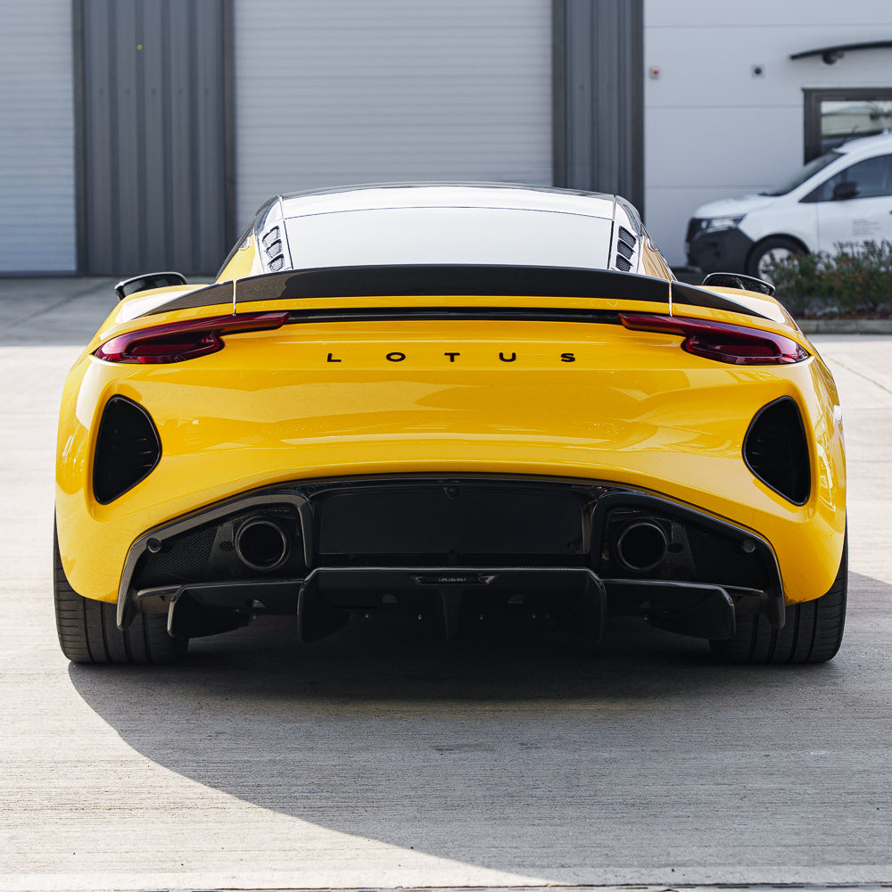 Yellow Lotus Emira 2022+ full carbon fibre kit by CT Carbon, featuring sleek aerodynamic components and detailed craftsmanship.