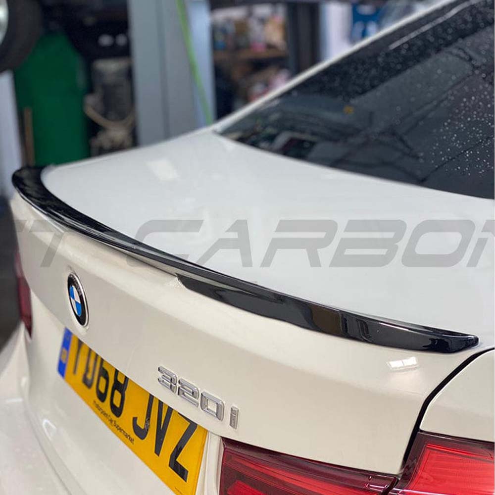 BMW 3 Series F30 gloss black full kit with dual exhaust by CT Carbon, featuring MP style design and high-quality carbon fiber details.