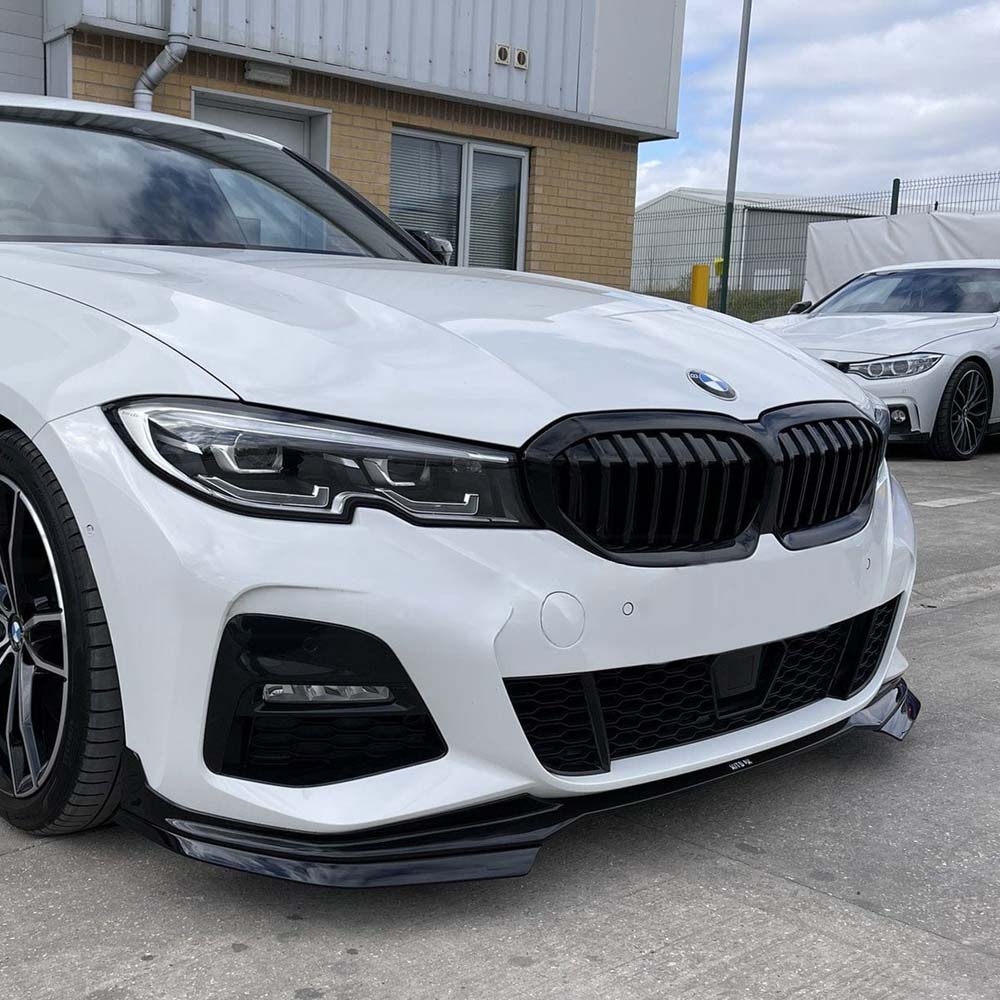 BMW 3 Series G20 gloss black full kit with round exhaust tips by CT Carbon, featuring a sleek, full-body design and MP-style exhaust exit.