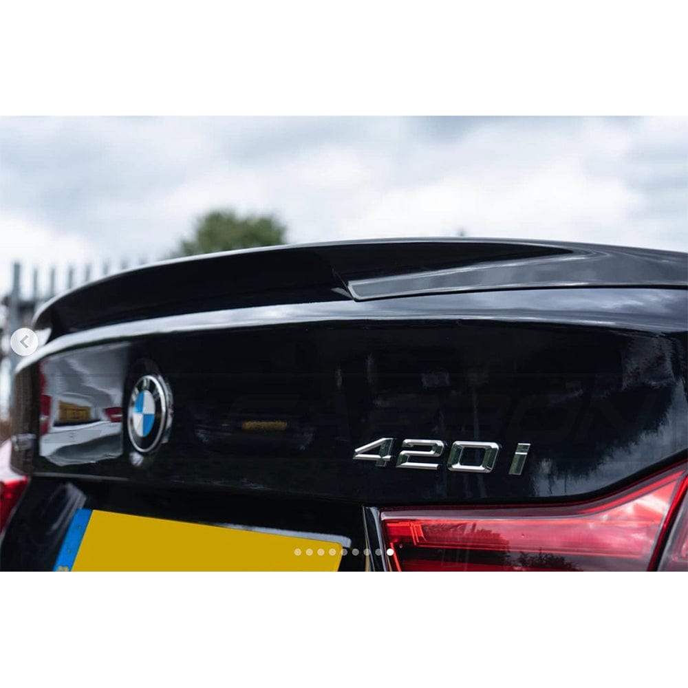 BMW 4 Series F36 2013-2020 CT Carbon gloss black full kit with dual exhaust tips, showcasing the sleek exterior upgrade.
