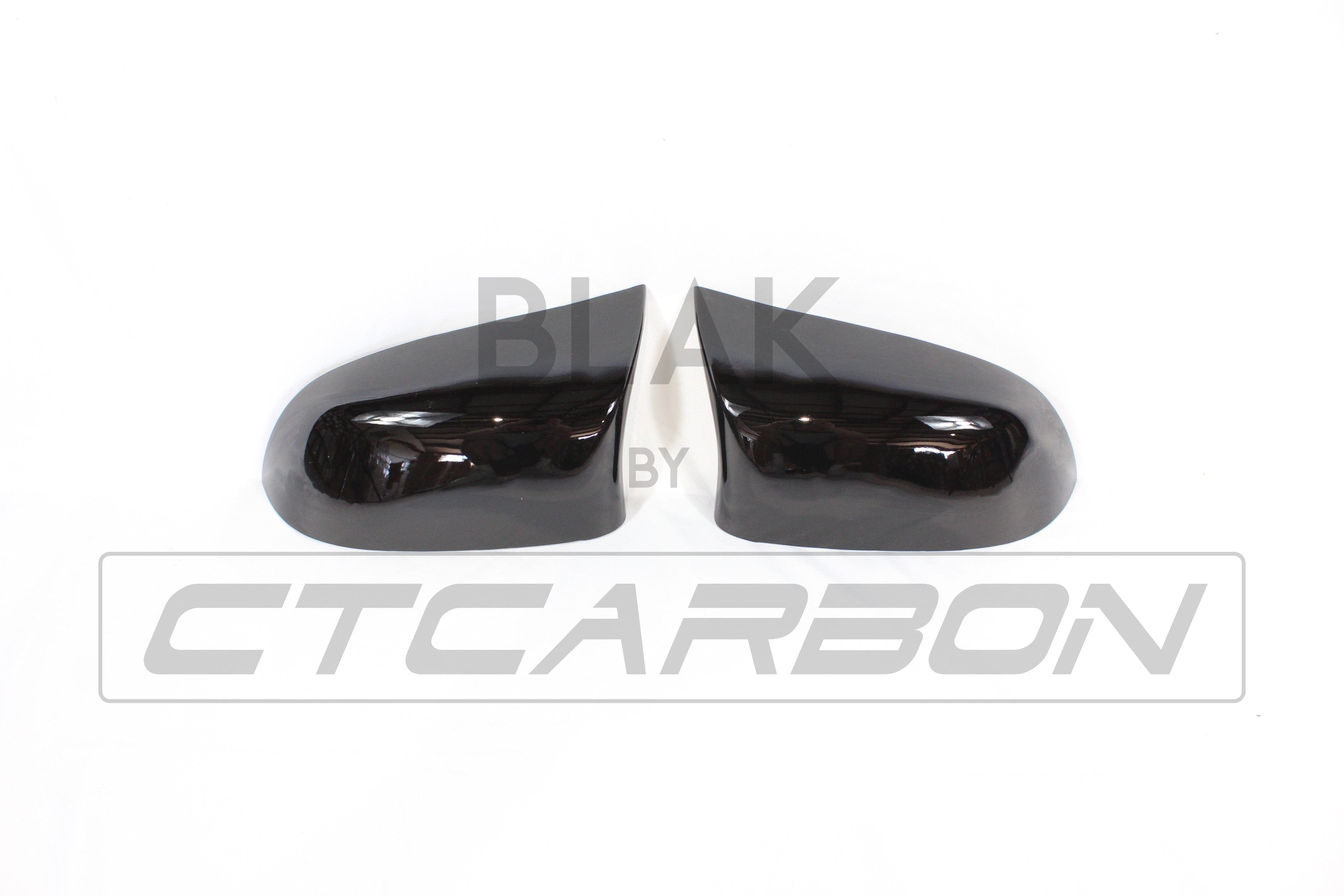 Gloss black mirror replacements for BMW F15/F16 X5/X6 from CT Carbon, showcasing sleek, high-quality exterior accessories.