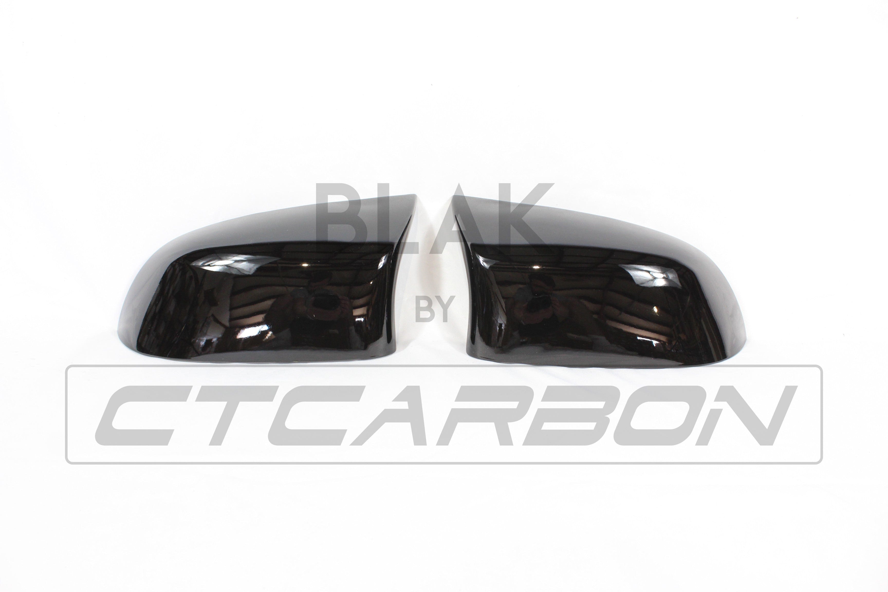 Gloss black BMW F15 F16 X5 X6 mirror replacements by CT Carbon, showing sleek exterior side mirrors with a glossy finish.
