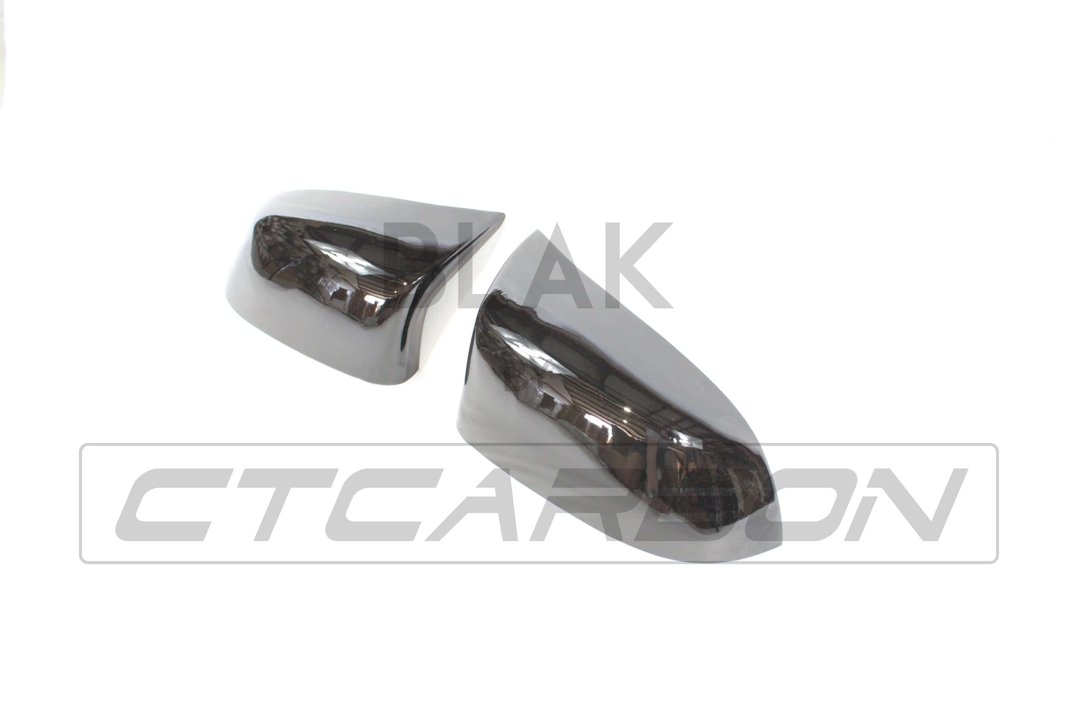Gloss black BMW F15/F16 X5/X6 mirror replacements by CT Carbon, showcasing sleek, reflective side mirror covers for 2014-2018 models.