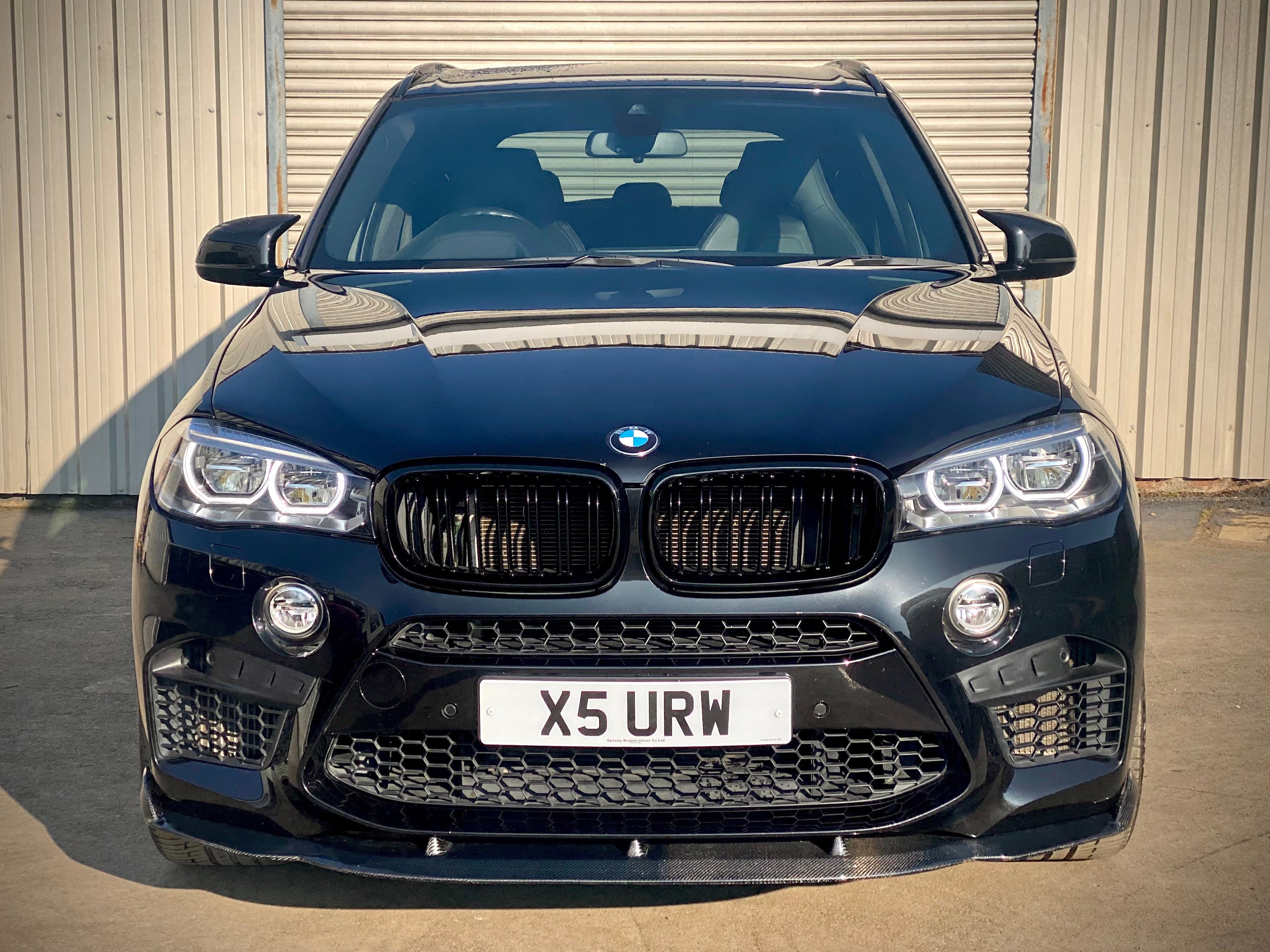 Black CT Carbon double slat grille for BMW X5M/X6M F16 F15 2014-2018, close-up of sleek, sporty grille design.