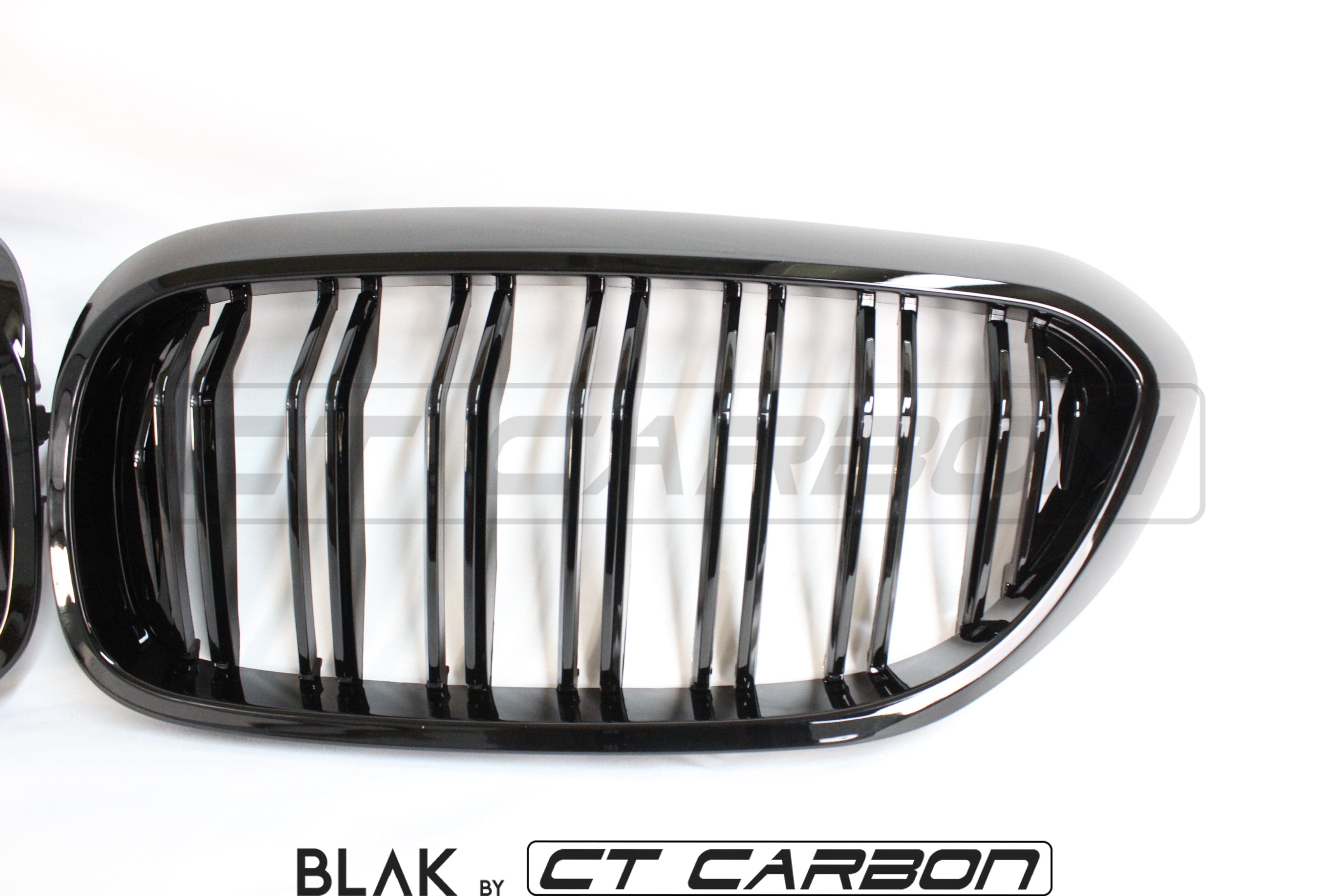 BMW M5 F90 and 5 Series G30 black double slat grille by CT Carbon, showing sleek black grille design on vehicle front.