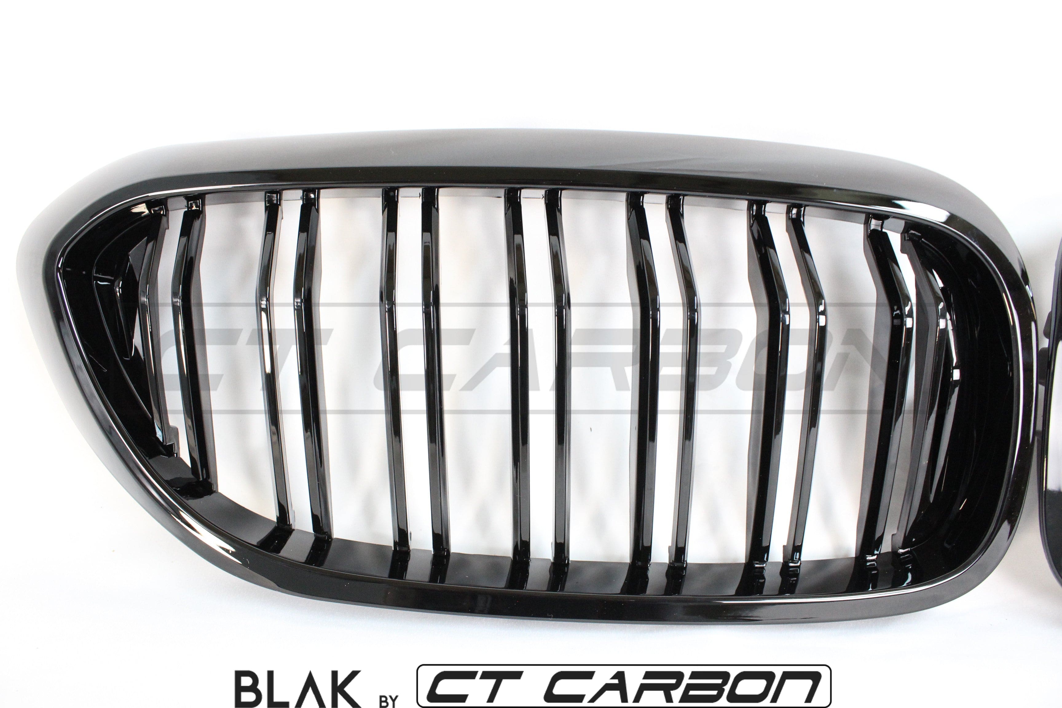 Black double slat grille for BMW M5 F90 and 5 Series G30, CT Carbon brand, showcasing sleek black design and car front detail.