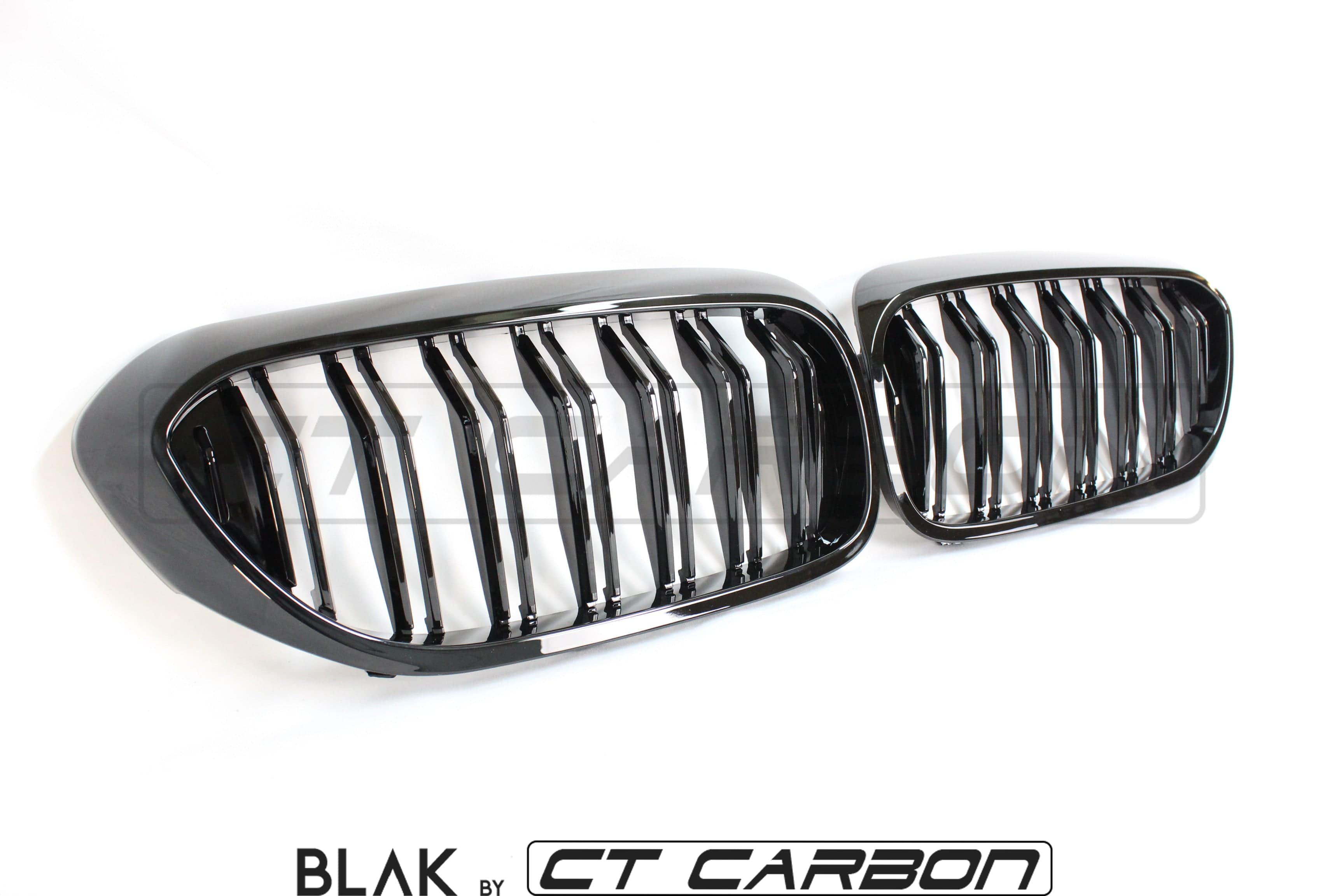 BMW M5 F90 and 5 Series G30 black double slat grille by CT Carbon, close-up view showing sleek black design and grille details.