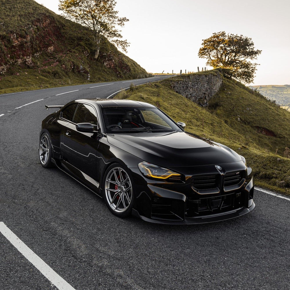 BMW G87 M2 TREVORA TR87 pre-preg carbon fibre side skirts with sleek finish and detailed design for 2023 model.