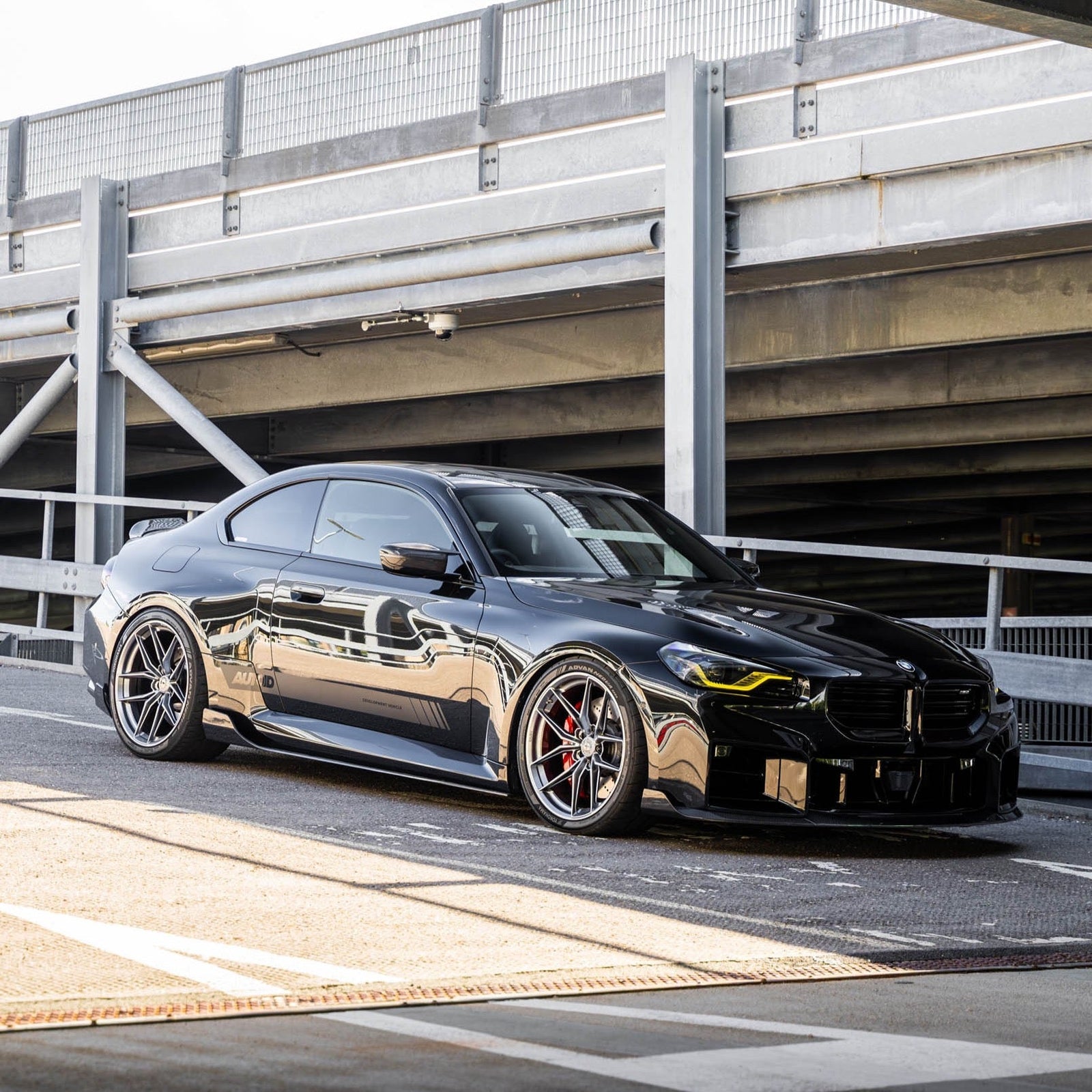 BMW G87 M2 TREVORA TR87 pre-preg carbon fibre side skirts, lightweight and sleek, with detailed carbon fiber weave visible.