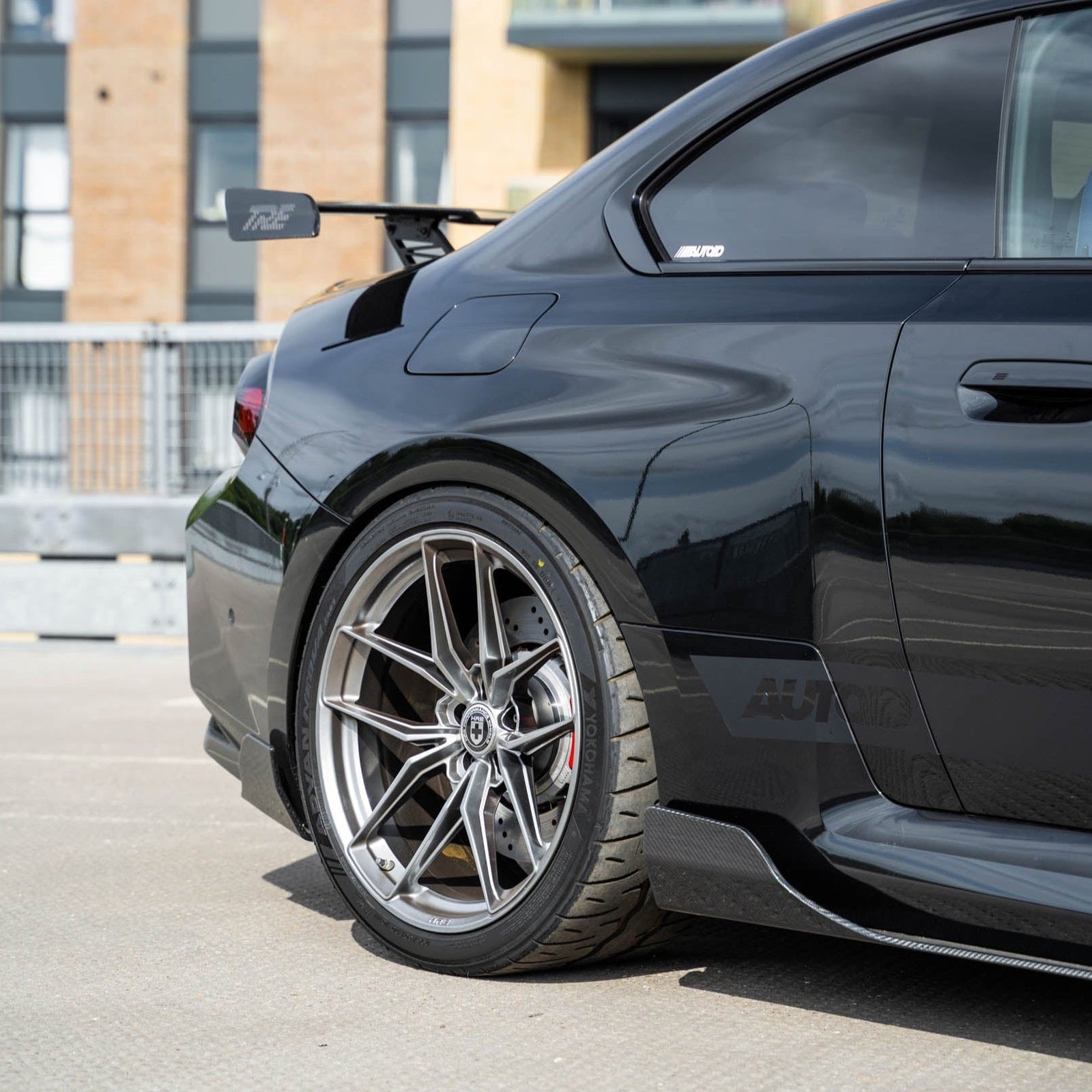BMW G87 M2 TREVORA TR87 pre-preg carbon fibre side skirts installed on the vehicle, showcasing sleek, lightweight aerodynamic design.