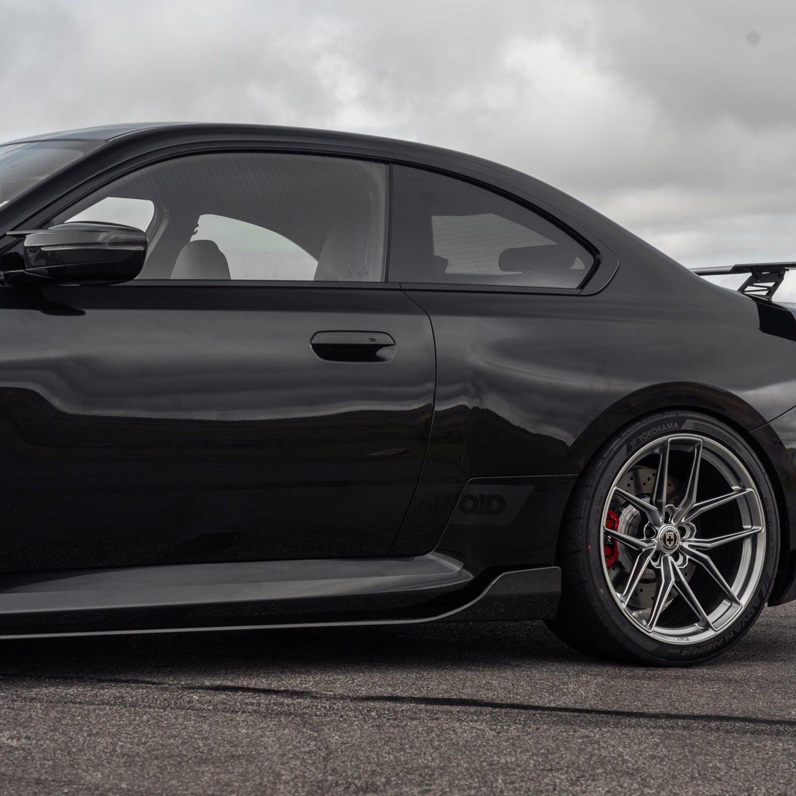 BMW G87 M2 TR87 pre-preg carbon fibre side skirts by TREVORA, showing sleek, lightweight side skirts with a carbon finish.