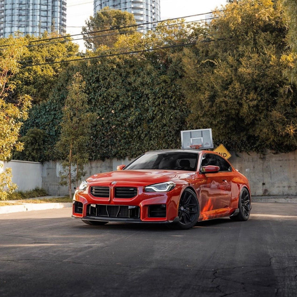 BMW G87 M2 TR87 carbon body kit by TREVORA, featuring sleek carbon fiber components and aerodynamic wing accents.