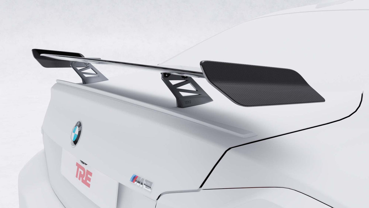BMW G87 M2 TR87 carbon body kit by TREVORA featuring winged carbon fiber components for enhanced aerodynamics and sporty look.