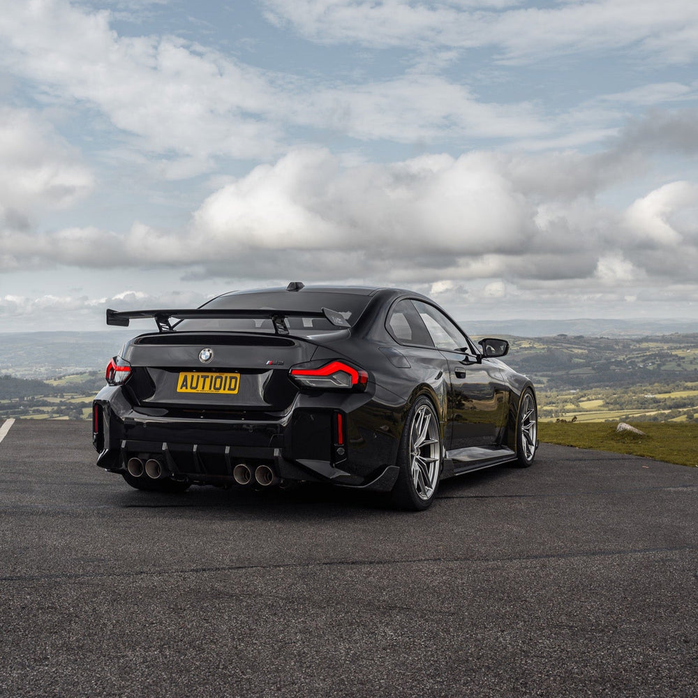 BMW G87 M2 TR87 front splitter with winglets made of pre-preg carbon fibre by TREVORA, featuring sleek aerodynamic design.