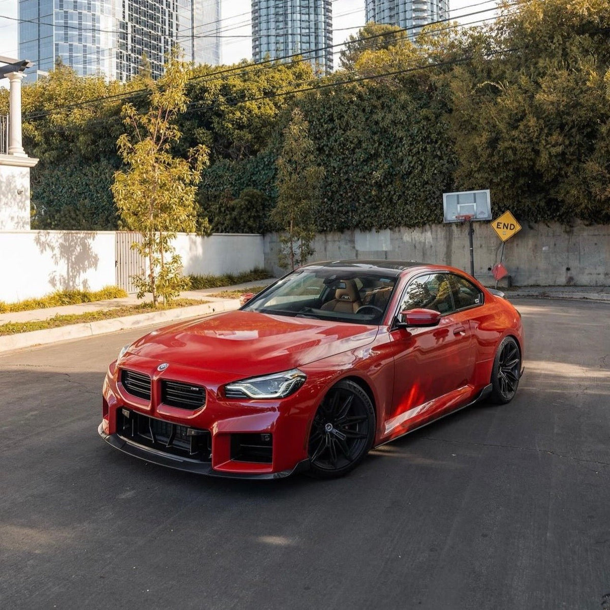 BMW G87 M2 TREVORA TR87 carbon body kit with winged carbon fiber components for enhanced sporty appearance.
