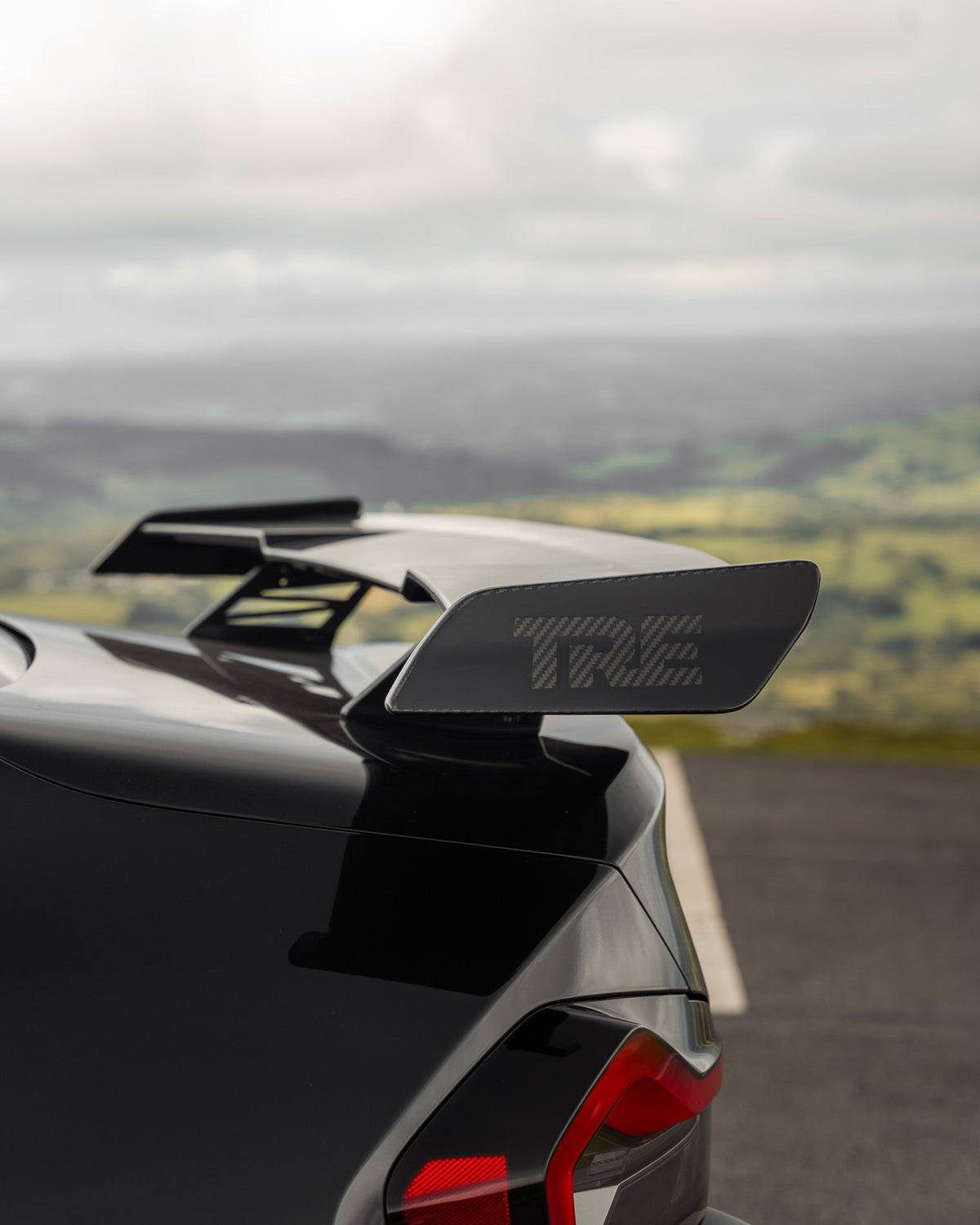 BMW M2 G87, 2 Series, and M240i G42 TREVORA carbon fiber rear wing spoiler showcasing aerodynamic design and lightweight construction.