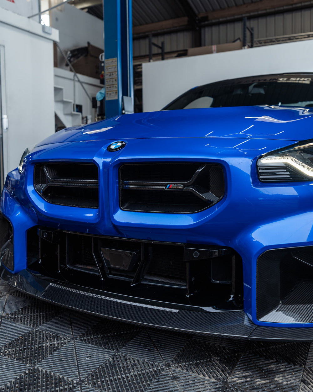 BMW M2 G87 front grille with pre-preg carbon fiber CSL style design by TREVORA, showcasing the sleek, high-performance automotive accessory.