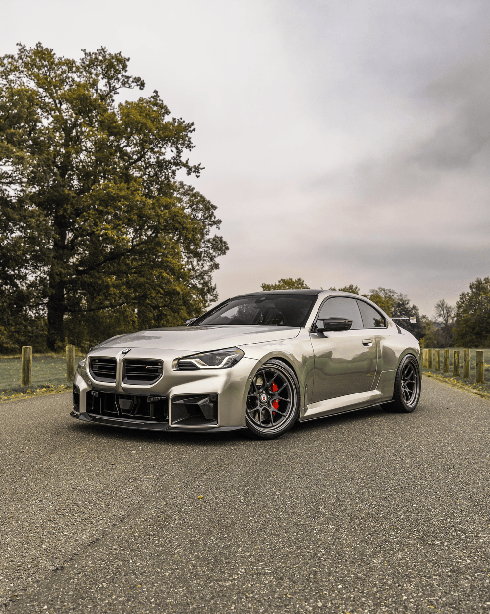 BMW M2 G87 front grill with Pre-Preg carbon fibre TR87 air ducts by TREVORA, showcasing sleek, high-performance automotive design.