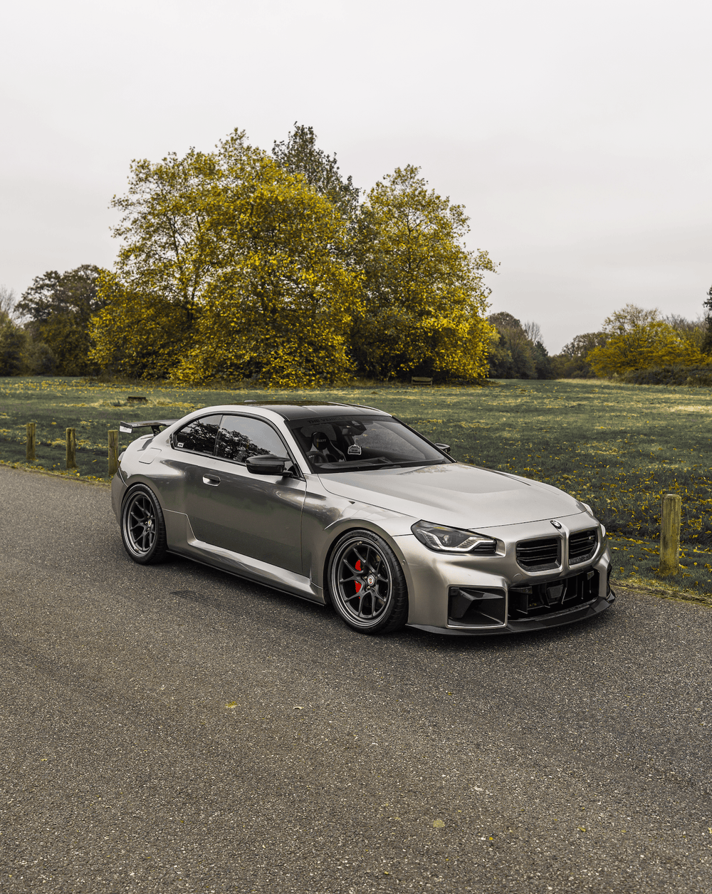 BMW M2 G87 front grill with Pre-Preg carbon fibre TR87 air ducts by TREVORA, showcasing sleek, lightweight automotive performance parts.