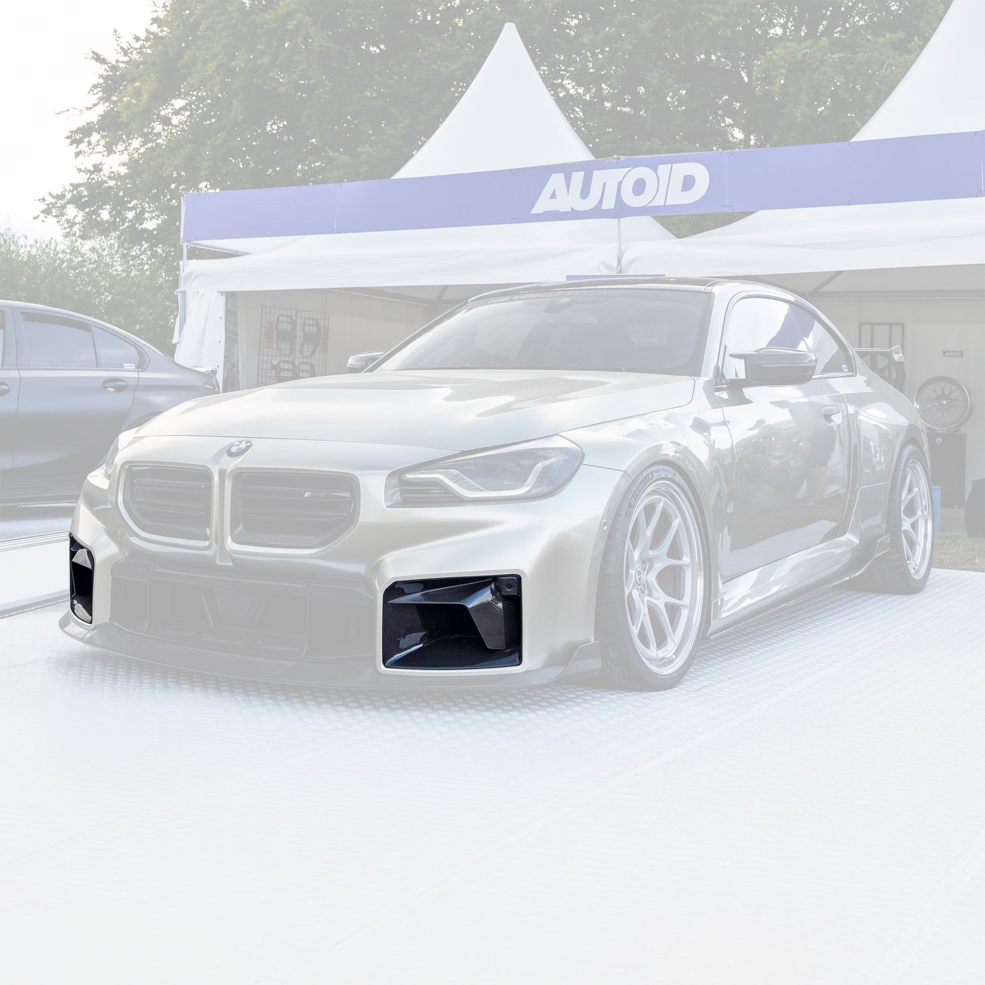 BMW M2 G87 front grill with pre-preg carbon fibre TR87 air ducts by TREVORA, showcasing sleek, lightweight aerodynamic design.