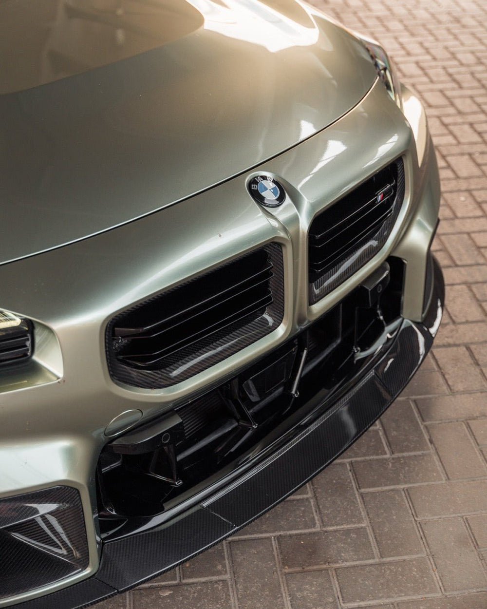 BMW M2 G87 front grille by TREVORA, made of pre-preg carbon fiber, featuring sleek design and precise fit for 2023-2024 models.