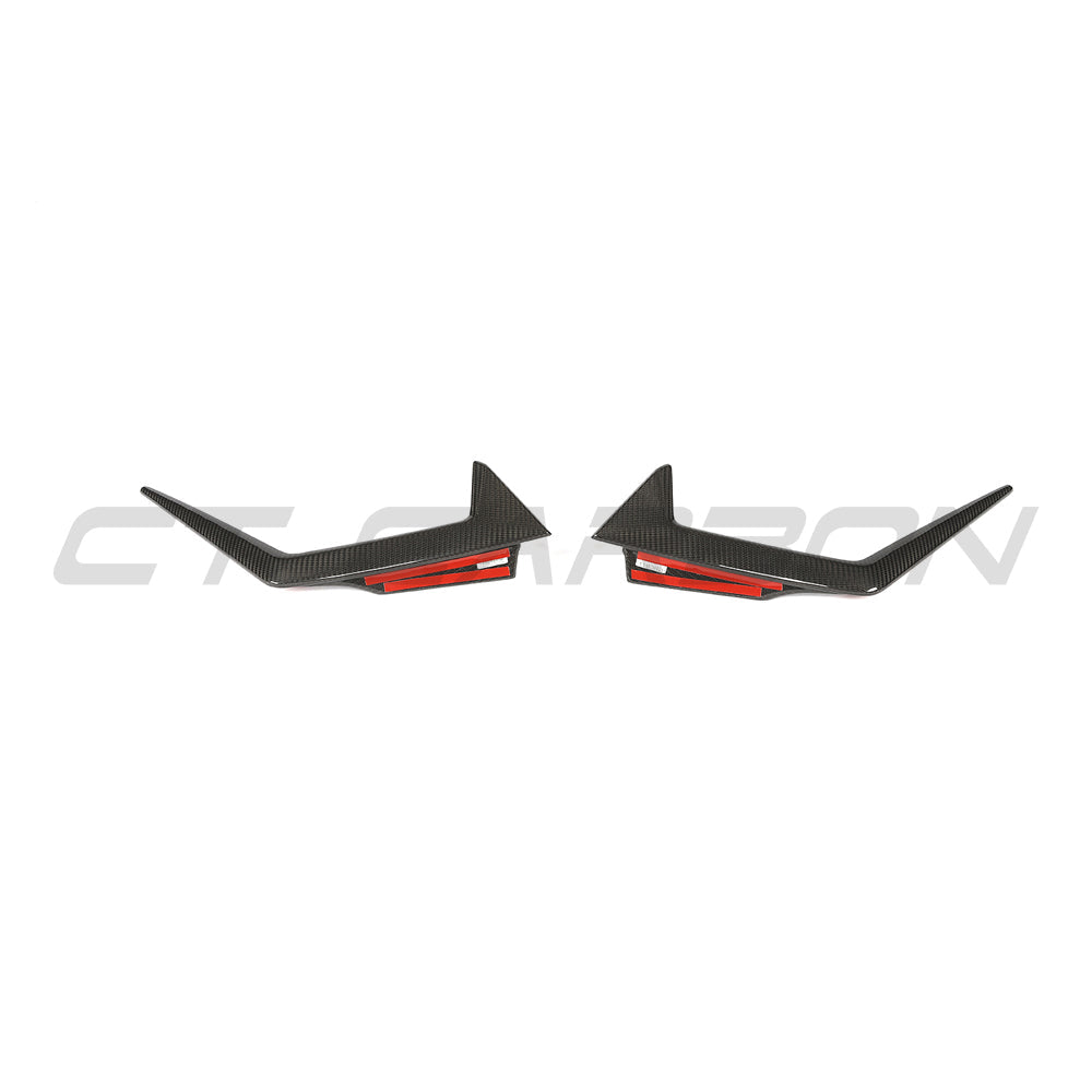 BMW G90 G99 M5 Touring carbon fiber front bumper trim by CT Carbon, close-up view of sleek, lightweight car accessory.