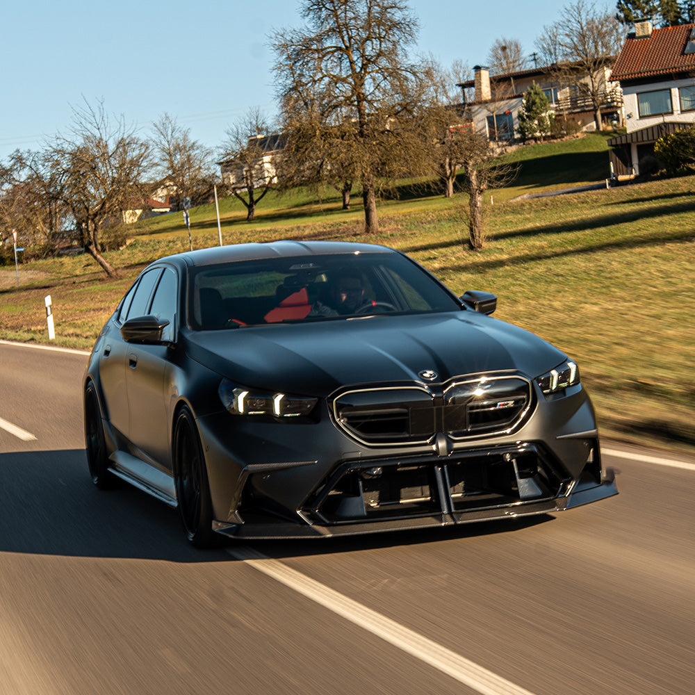 BMW G90 G99 M5 Touring 2024 carbon fibre splitter by CT Design, showcasing the sleek aerodynamic front splitter detail.