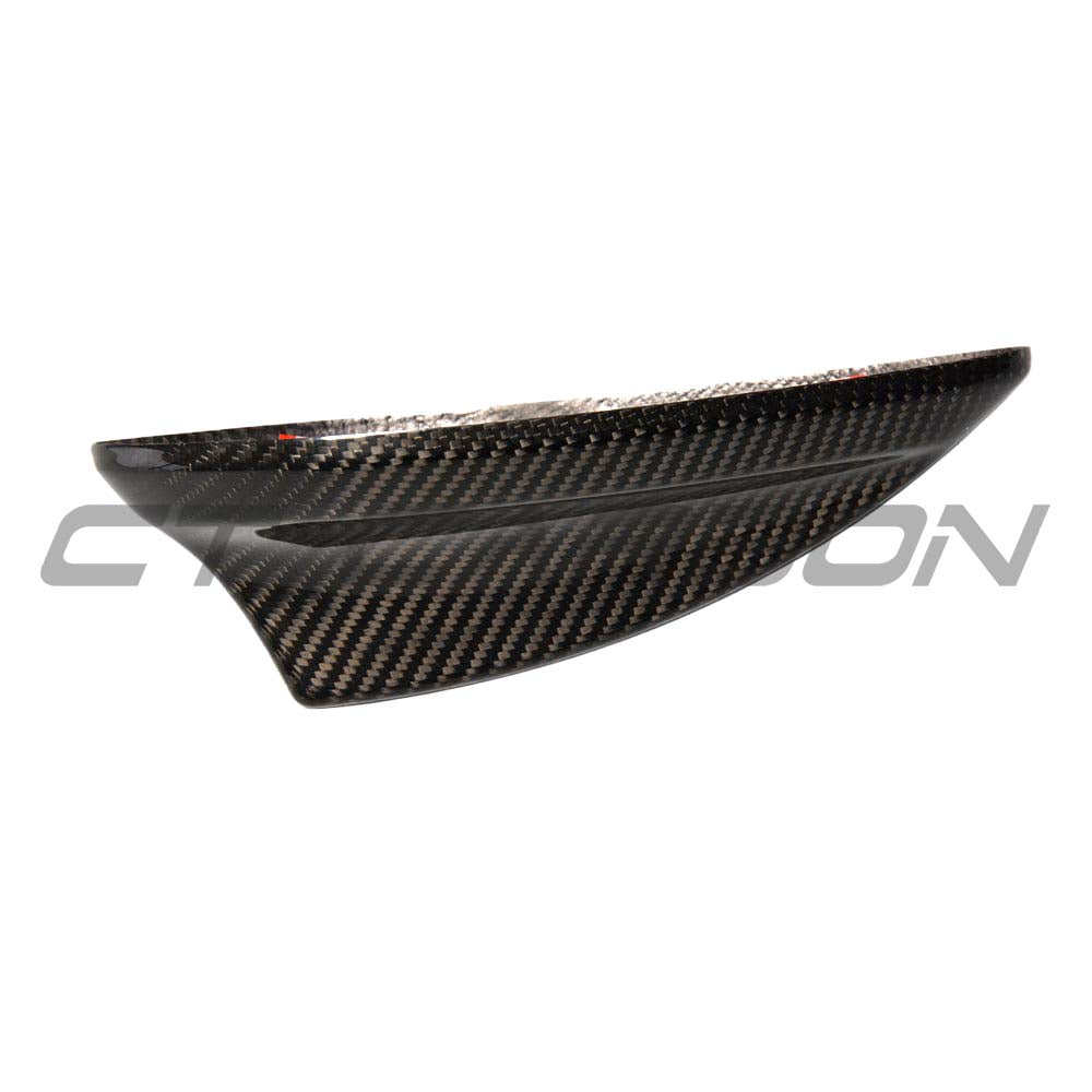 BMW Fxx carbon fibre antenna cover by CT Carbon, close-up of sleek, lightweight automotive antenna accessory for BMW Fxx series.