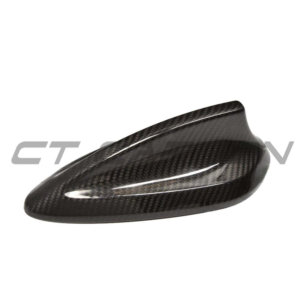 BMW Fxx carbon fibre antenna cover by CT Carbon, showcasing sleek black textured finish on a vehicle antenna.