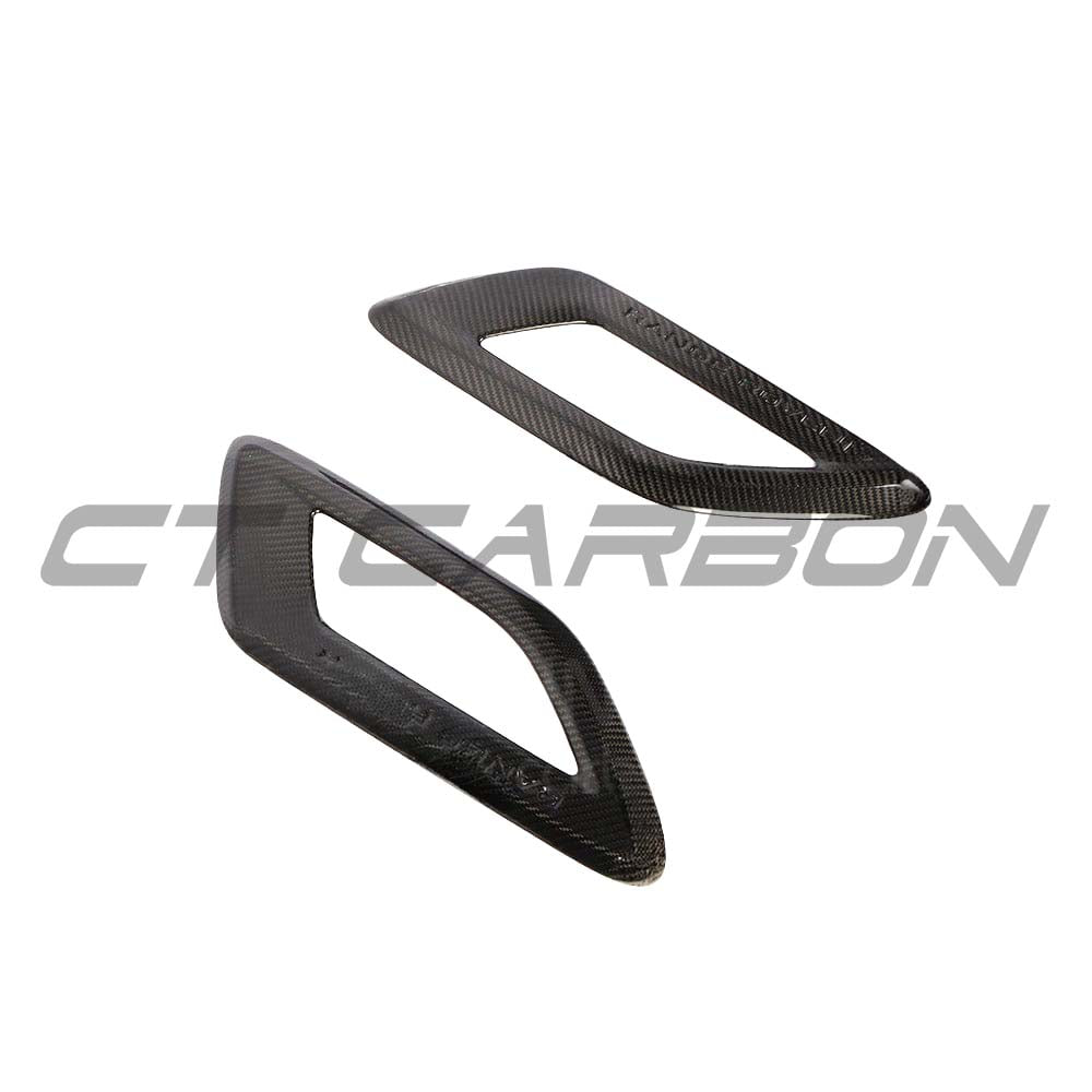 Carbon fibre bonnet intake trim for Range Rover Sport by CT Carbon, showcasing sleek, textured carbon fibre details on the vehicle's hood.