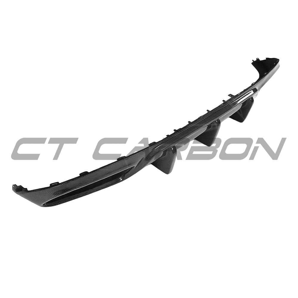 Carbon diffuser for Mercedes W205 C63 coupe by CT Carbon, showcasing sleek black aerodynamic design on the car's rear.