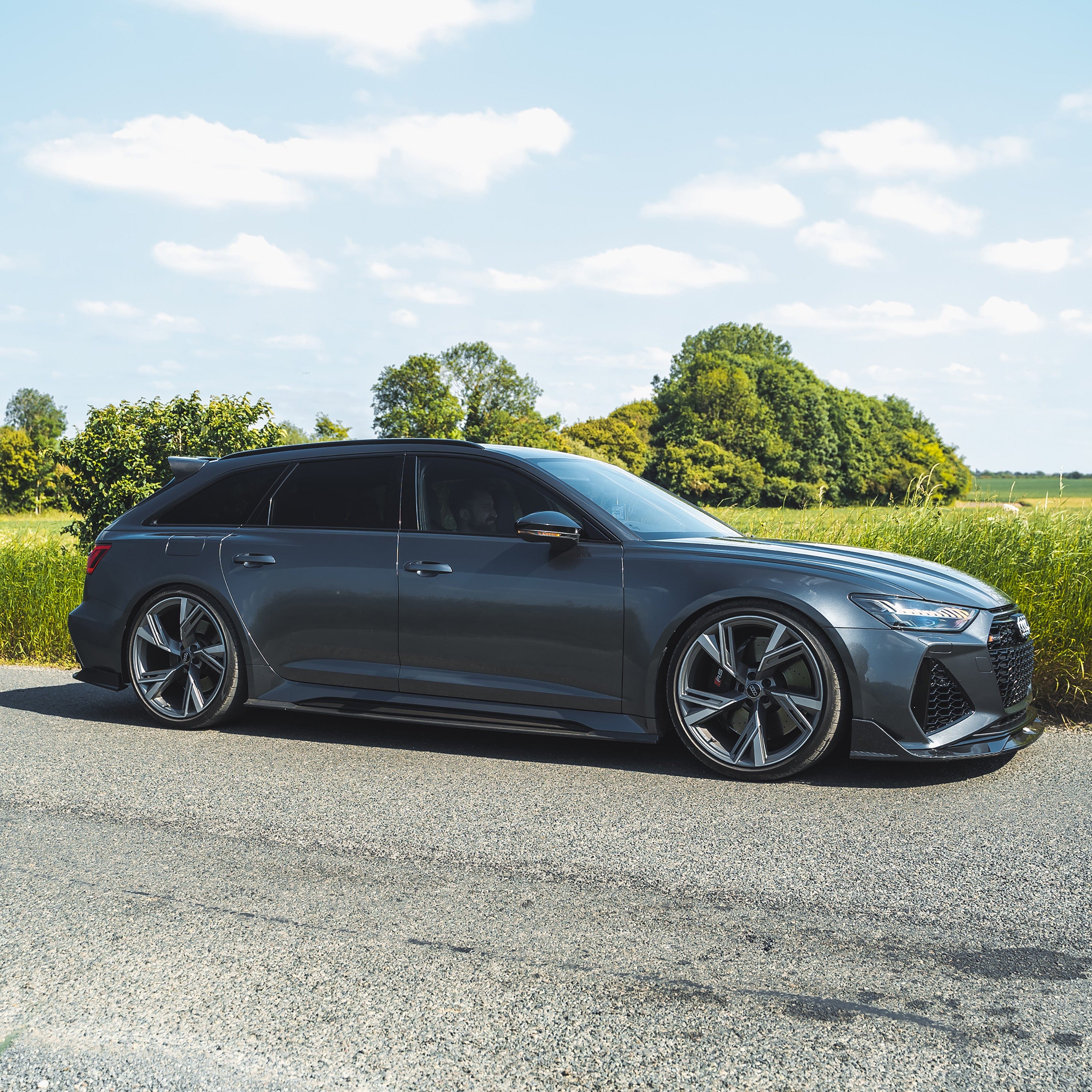 Carbon fibre side skirts for Audi RS6/RS7 C8 Avant 2019+ by CT Carbon, showcasing sleek, textured automotive side styling.