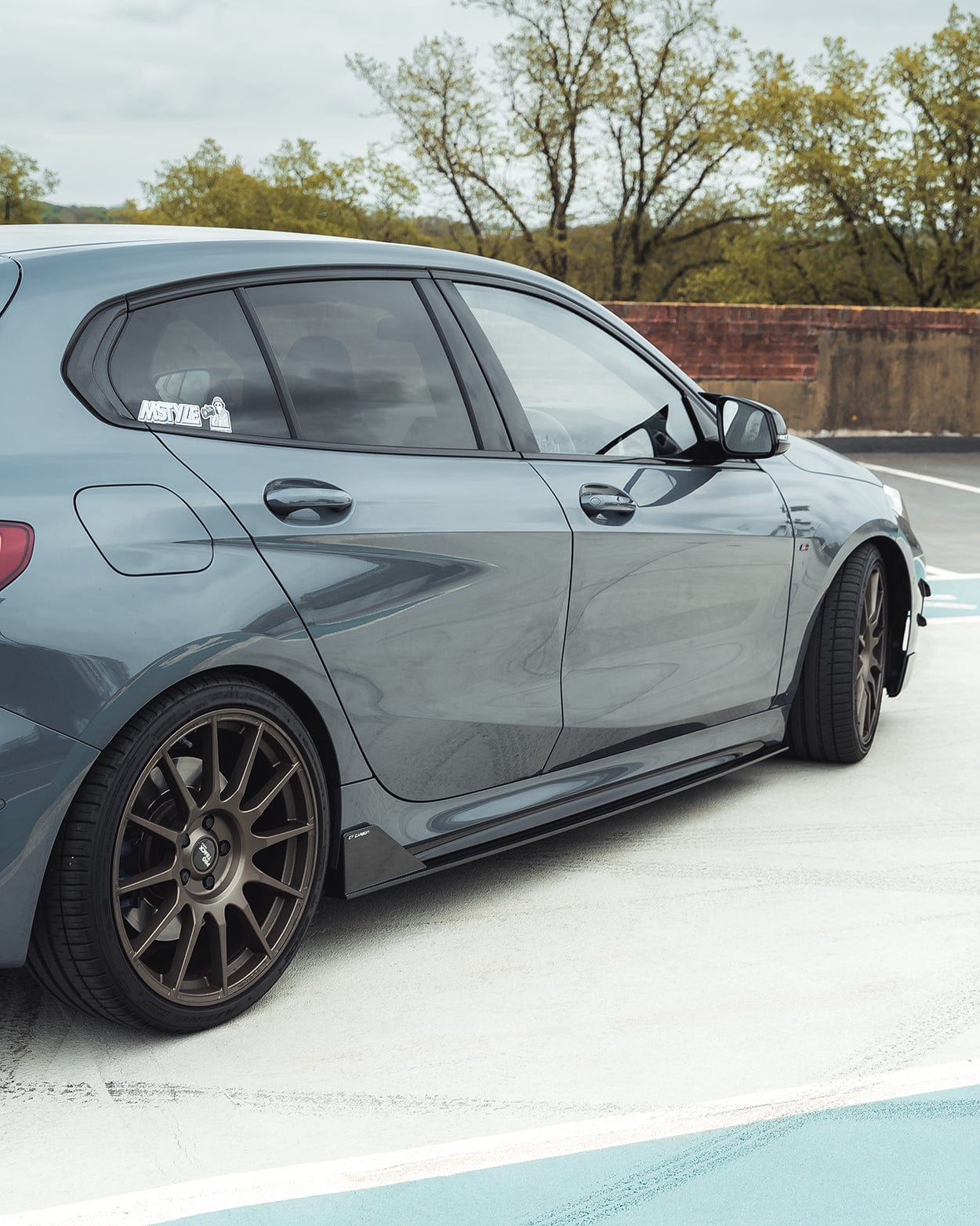 BMW 1 Series F40 2019-2024 CT Carbon full carbon fiber kit, including front splitter, side skirts, and rear diffuser, installed on the car.