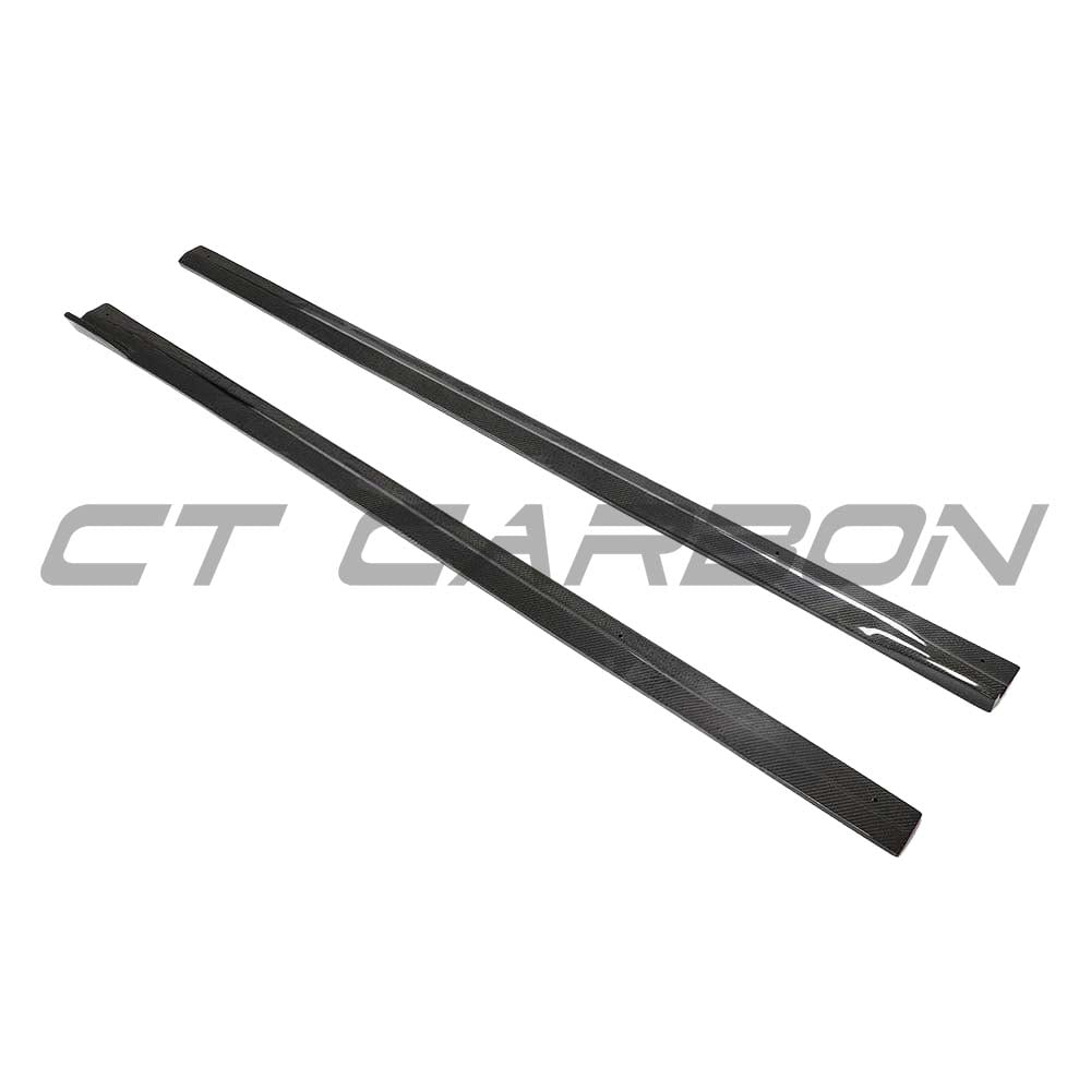 BMW F87 M2 2016-2018 CT Carbon full carbon fibre side skirts with 3D style design on a black background.