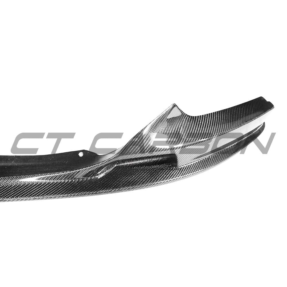 BMW 2 Series F22 carbon fiber front lip splitter kit by CT Carbon, showcasing sleek, textured carbon fiber design on the front bumper.