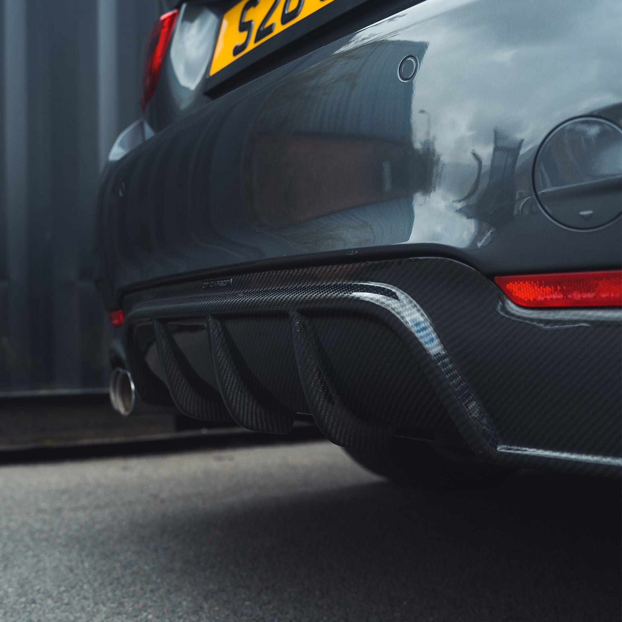 BMW F32 4 Series Coupe CT Carbon full carbon fiber kit with splitter and twin exhaust visible, showcasing sleek, lightweight performance parts.