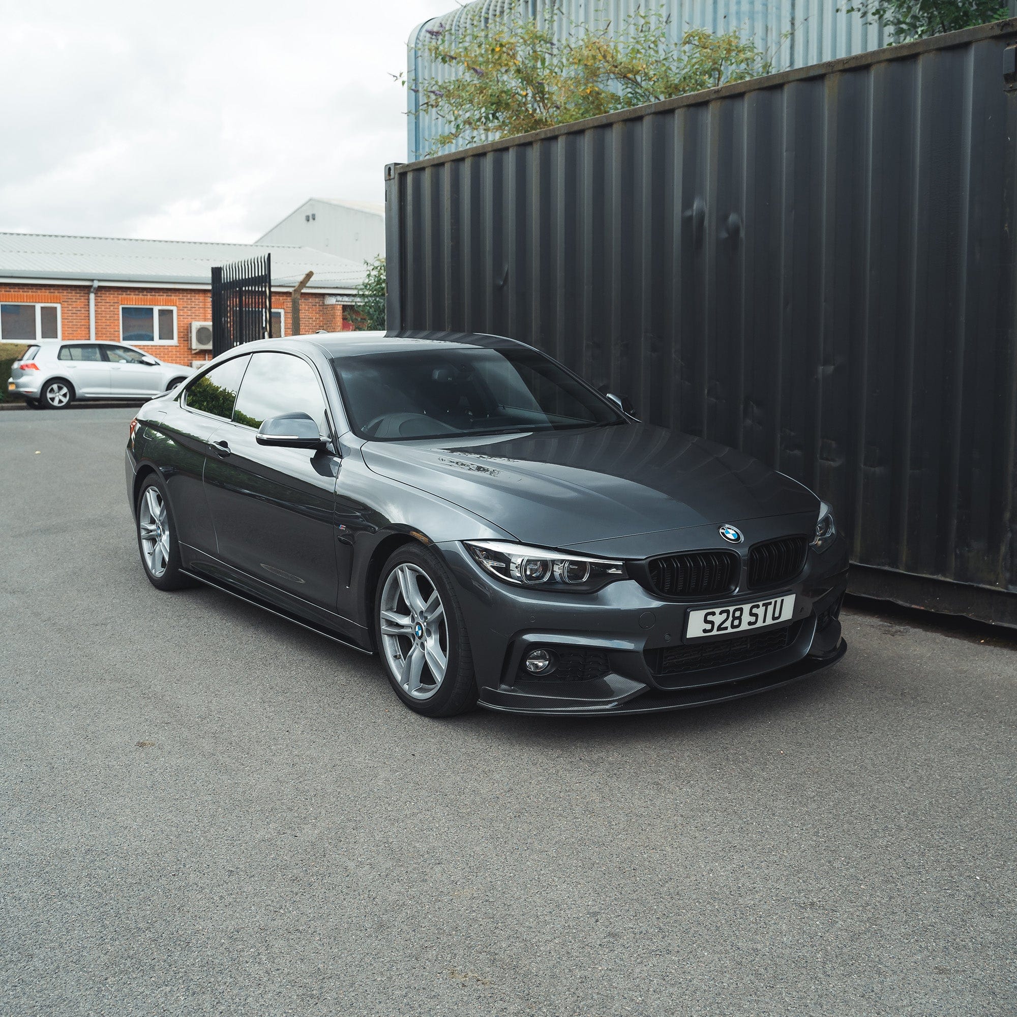 BMW F32 4 Series Coupe full carbon fiber kit by CT Carbon with twin exhaust, featuring splitter and MP style components.