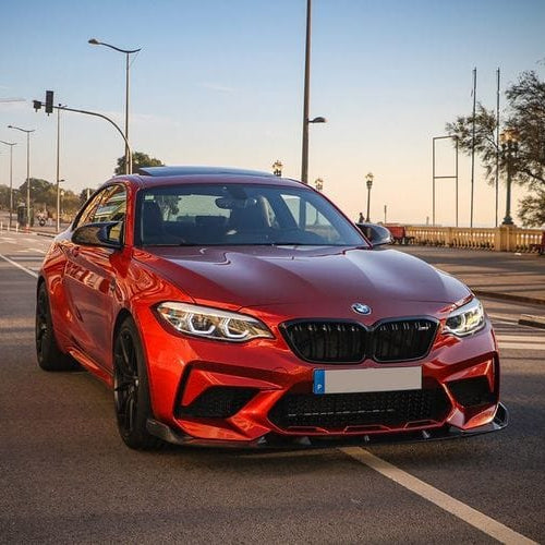BMW F87 M2C Competition full carbon fiber kit by CT Carbon, featuring splitters and aerodynamic components on a sleek sports car.