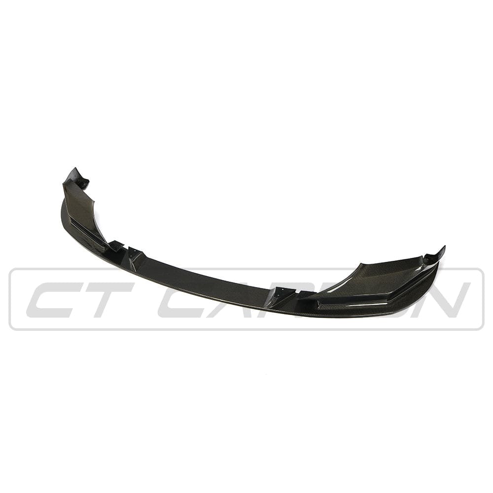 BMW F90 M5 Competition CT Carbon V2 carbon fibre splitter, close-up of sleek, aerodynamic front splitter with detailed carbon fibre weave.