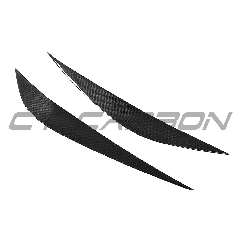 Carbon fibre eye lids accessory for BMW M3 M4 F80 F82 F83 models, by CT Carbon, shown on the vehicle with a sleek finish.