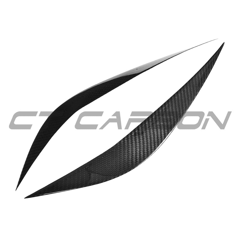 BMW M3 M4 F80 F82 F83 carbon fibre eye lids accessories by CT Carbon, close-up view of sleek, lightweight carbon fibre eye lids.