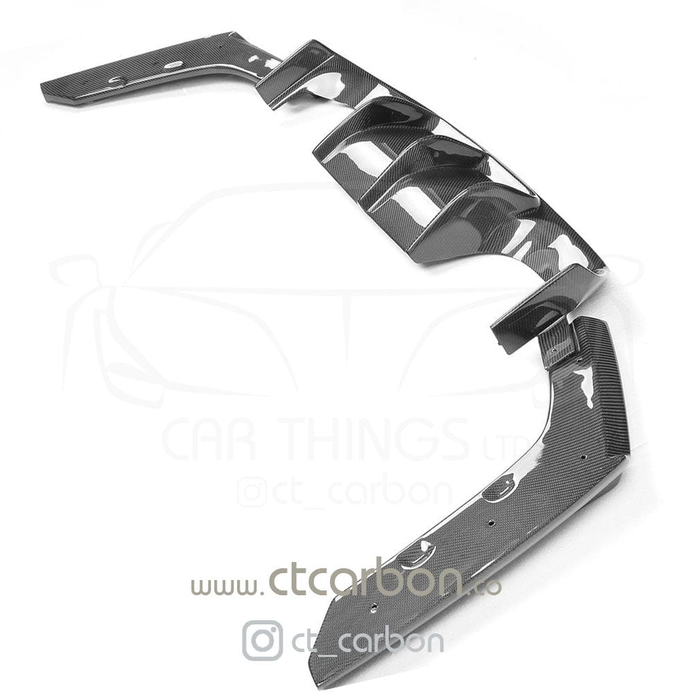 BMW M4 F83 convertible full carbon fibre kit by CT Carbon, featuring splitter and V-style accents on the car's exterior.