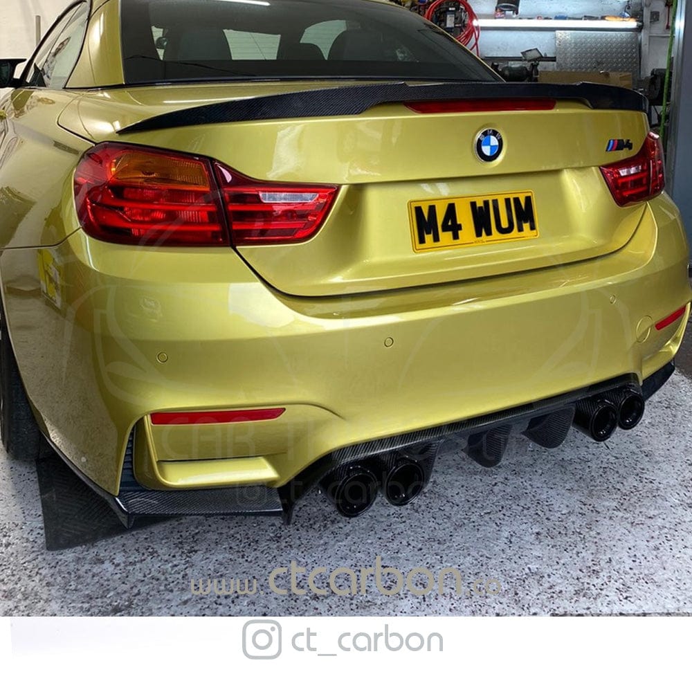 Full BMW M4 F83 convertible with CT Carbon V-style full carbon fiber kit, including splitter, showcasing sleek carbon fiber details.