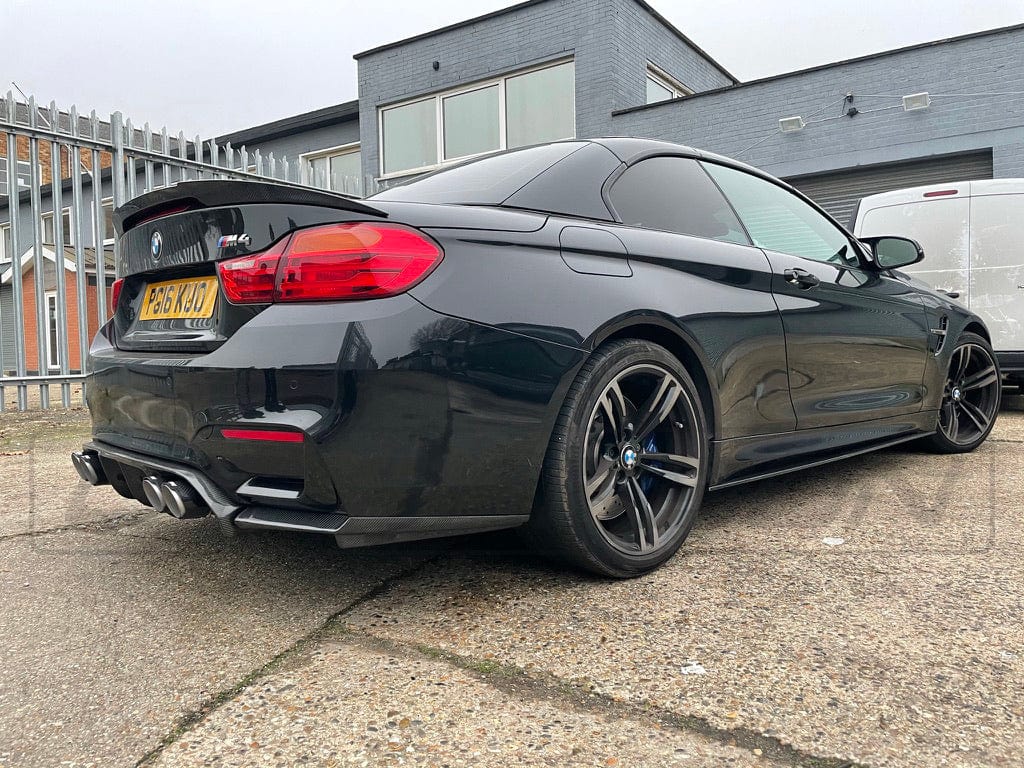 BMW M4 F83 convertible full carbon fibre kit by CT Carbon, featuring splitter and V-style design on a sleek carbon fibre finish.
