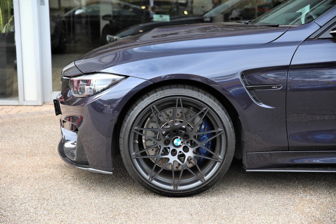 BMW M4 F83 convertible with CT Carbon full carbon fiber kit, showing the splitter and aerodynamic enhancements on the car.