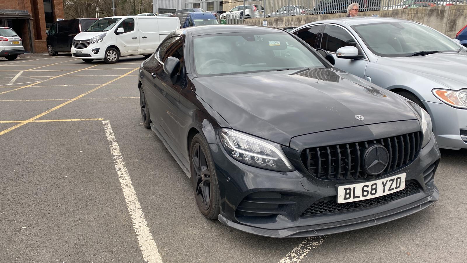 Carbon fiber splitter for Mercedes C43 and C-Class W205 facelift, designed by CT Carbon, showcasing sleek, aerodynamic styling.