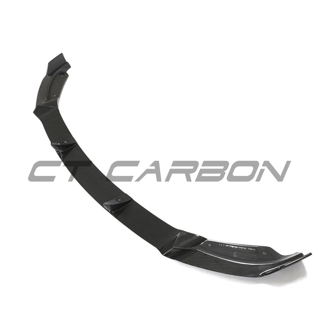 Tesla Model Y MK1 carbon fibre splitter by CT Carbon, close-up view showing sleek aerodynamic design and textured carbon fiber surface.