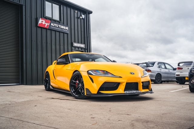CT Carbon Toyota Supra 2019+ A90 carbon fibre splitter, front aerodynamic upgrade, with sleek textured finish and mounting points visible.
